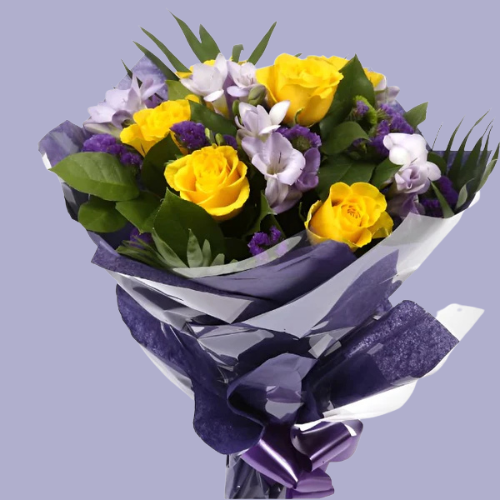 “Bouquet of yellow roses, lilac freesias, and purple flowers with greenery, wrapped in purple paper – under £35 UK flower delivery.”