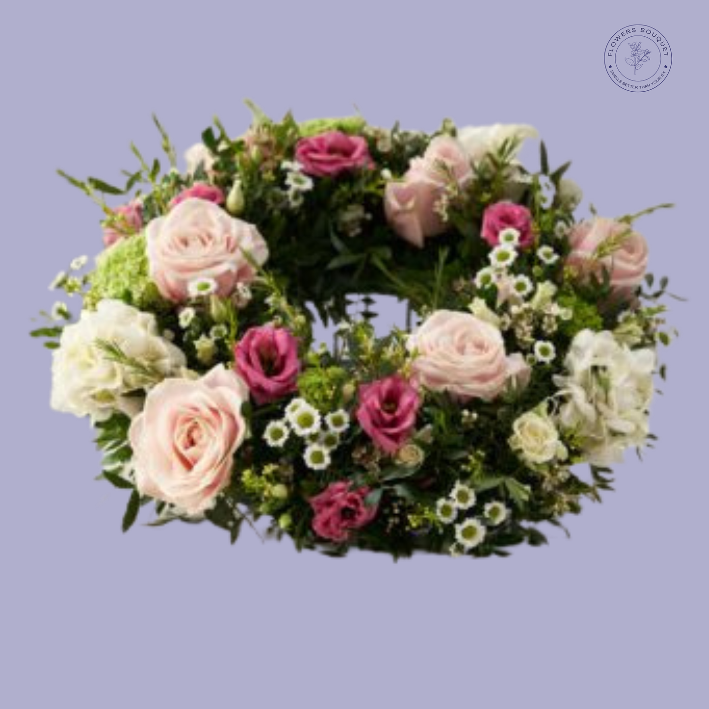Elegant funeral wreath featuring pink roses, lisianthus, ivory spray roses, and lush greenery for a graceful tribute.