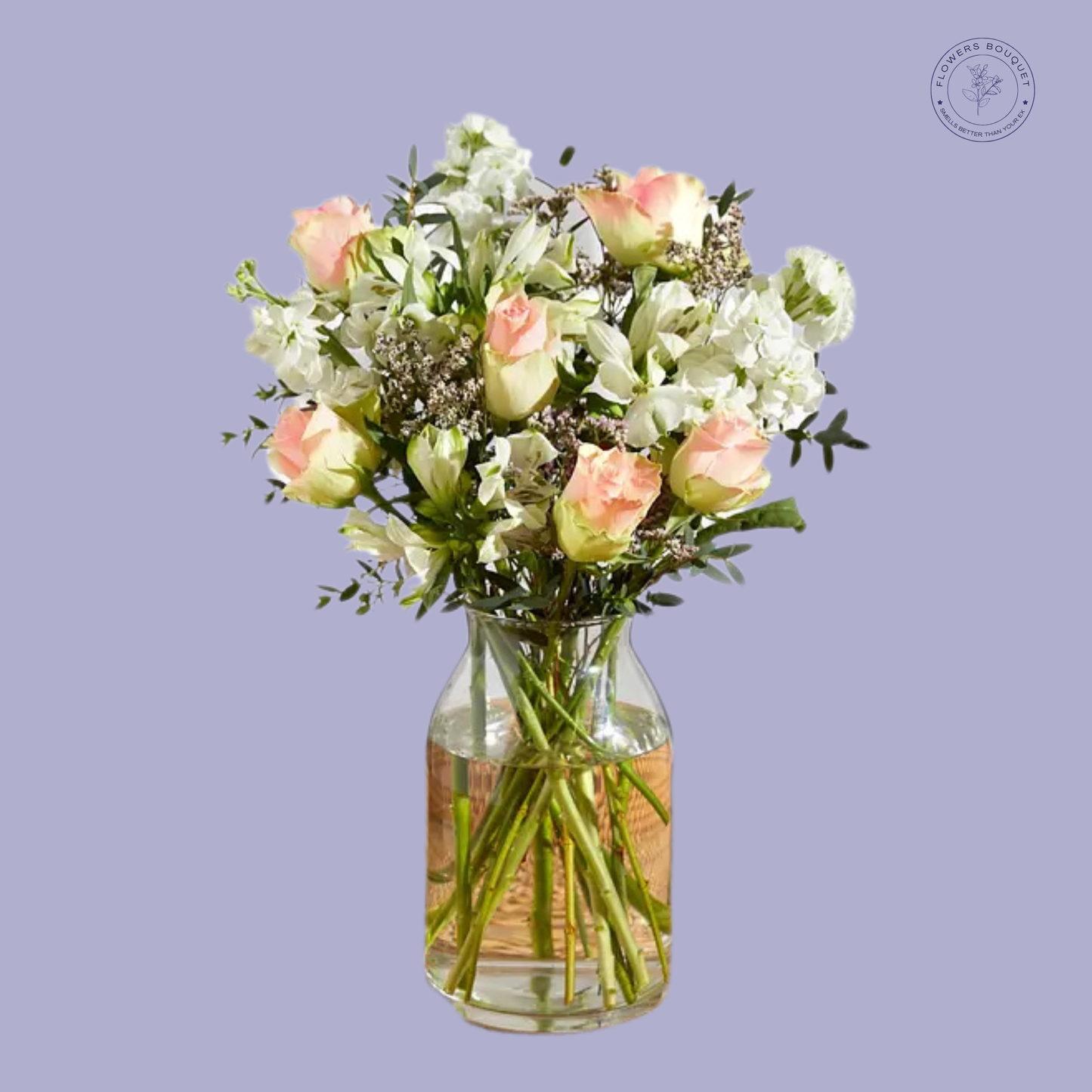 Ethereal Elegance Arrangement with pale pink roses, white alstroemeria, snapdragons, and baby's breath in a glass vase.