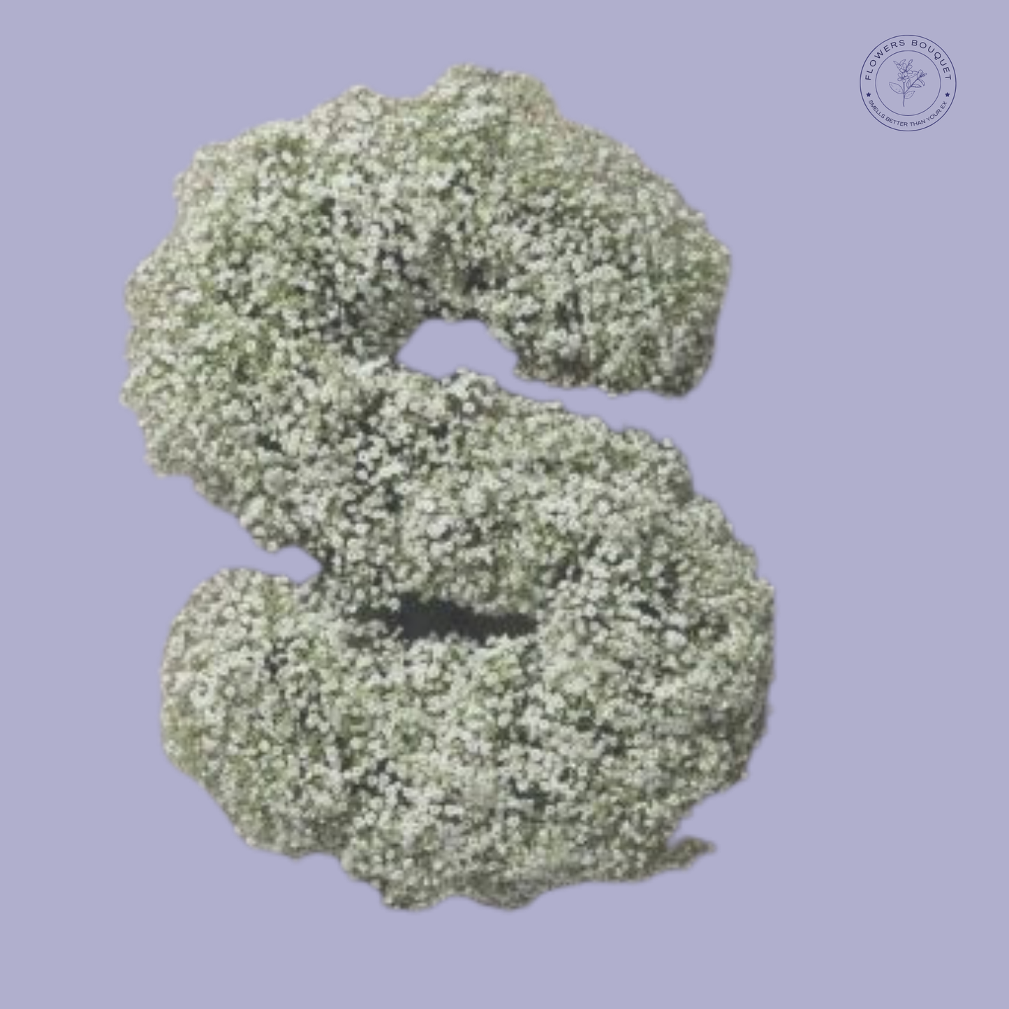 Floral letter tribute shaped with delicate white baby’s breath flowers.