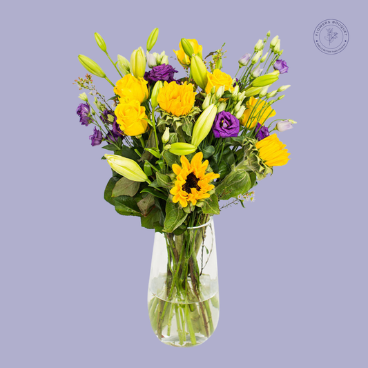 Sunflower and Mixed Bloom Bouquet with yellow sunflowers, lilies, lisianthus, and fresh greenery.