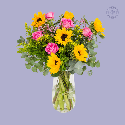 Sunny Pink Rose and Sunflower Bouquet with sunflowers, pink roses, and eucalyptus leaves.