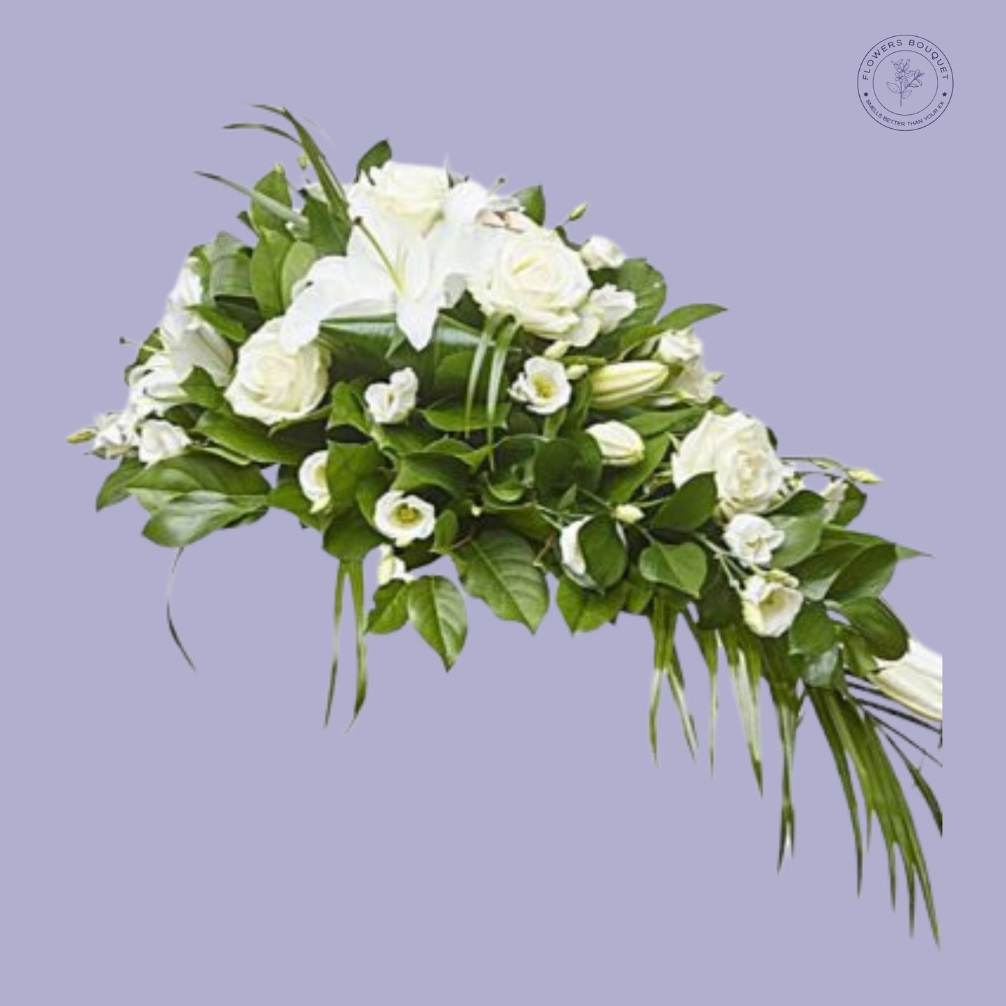 White lily and rose funeral spray with lush greenery.