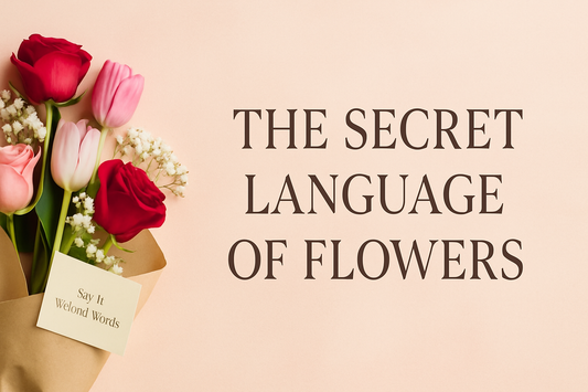 Elegant flat-lay of a mixed bouquet featuring red, pink, and white flowers on a soft pastel background, designed as a classy banner for a flower blog titled The Secret Language of Flowers.