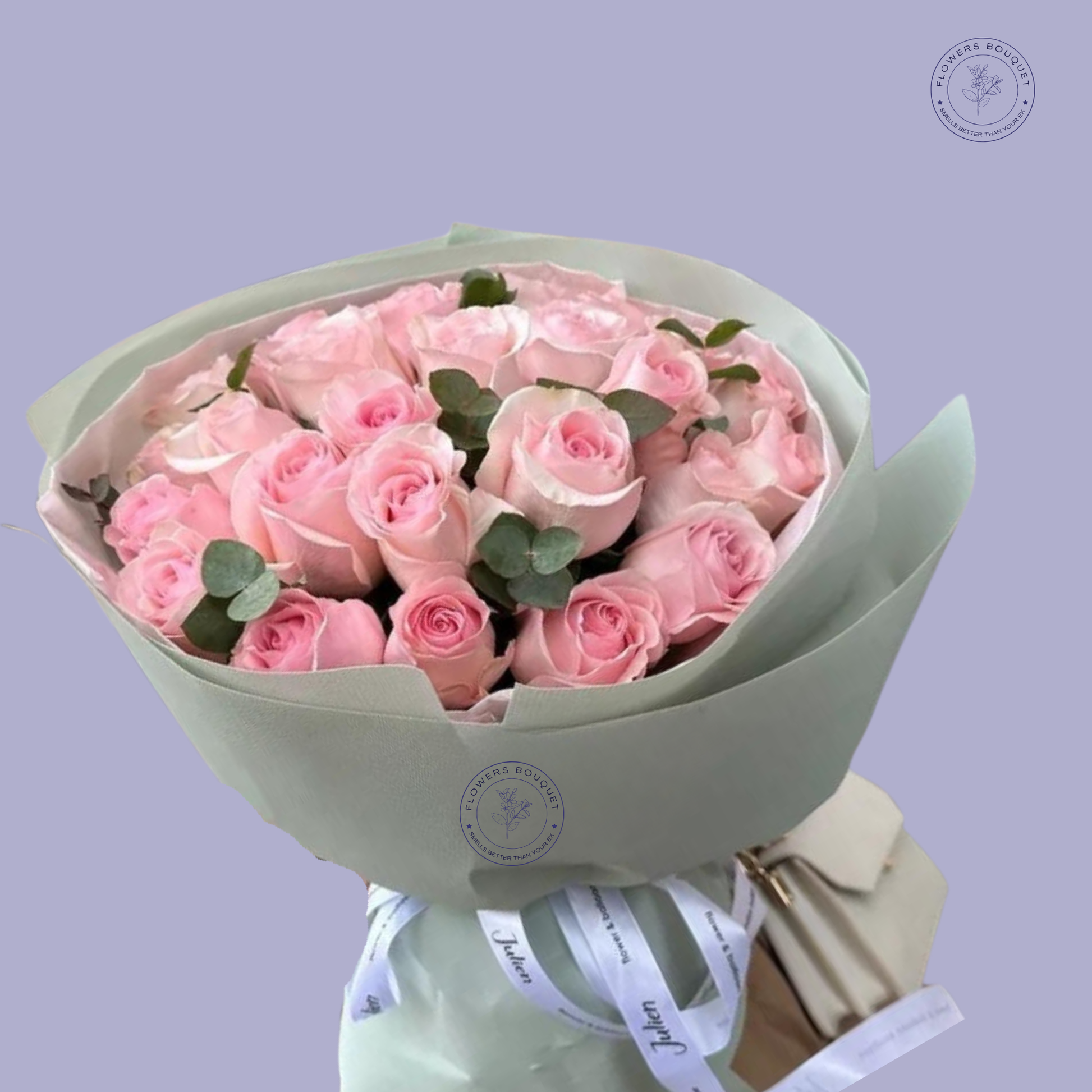 36 Pink Roses Bouquet with eucalyptus leaves wrapped in pastel green paper and tied with satin ribbons.