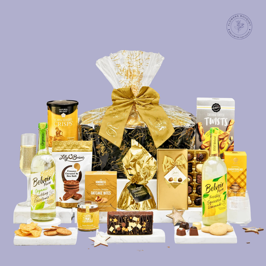 A luxurious gift hamper featuring sparkling elderflower lemonade, chocolates, crisps, oatcak