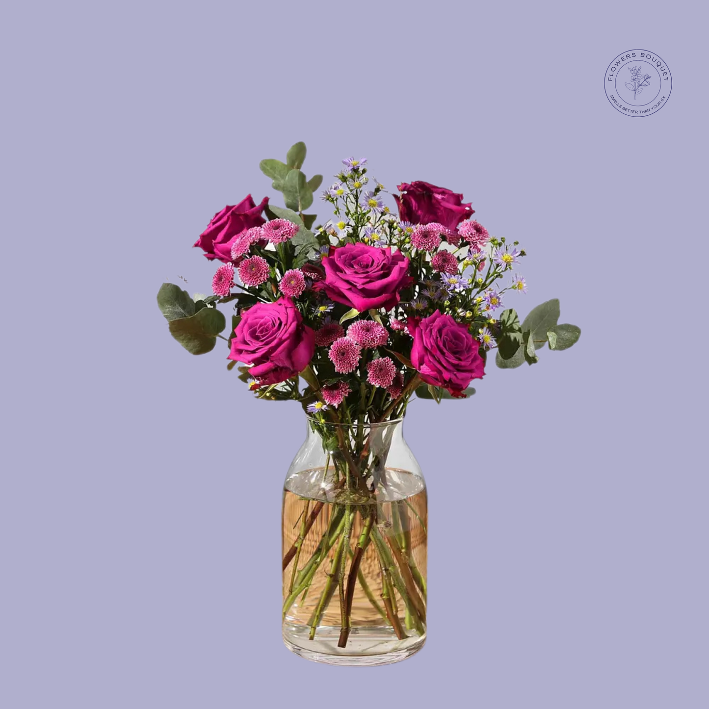 A vibrant floral arrangement called "Amethyst Romance," featuring deep magenta roses, pink daisies, and eucalyptus in a clear glass vase with water.