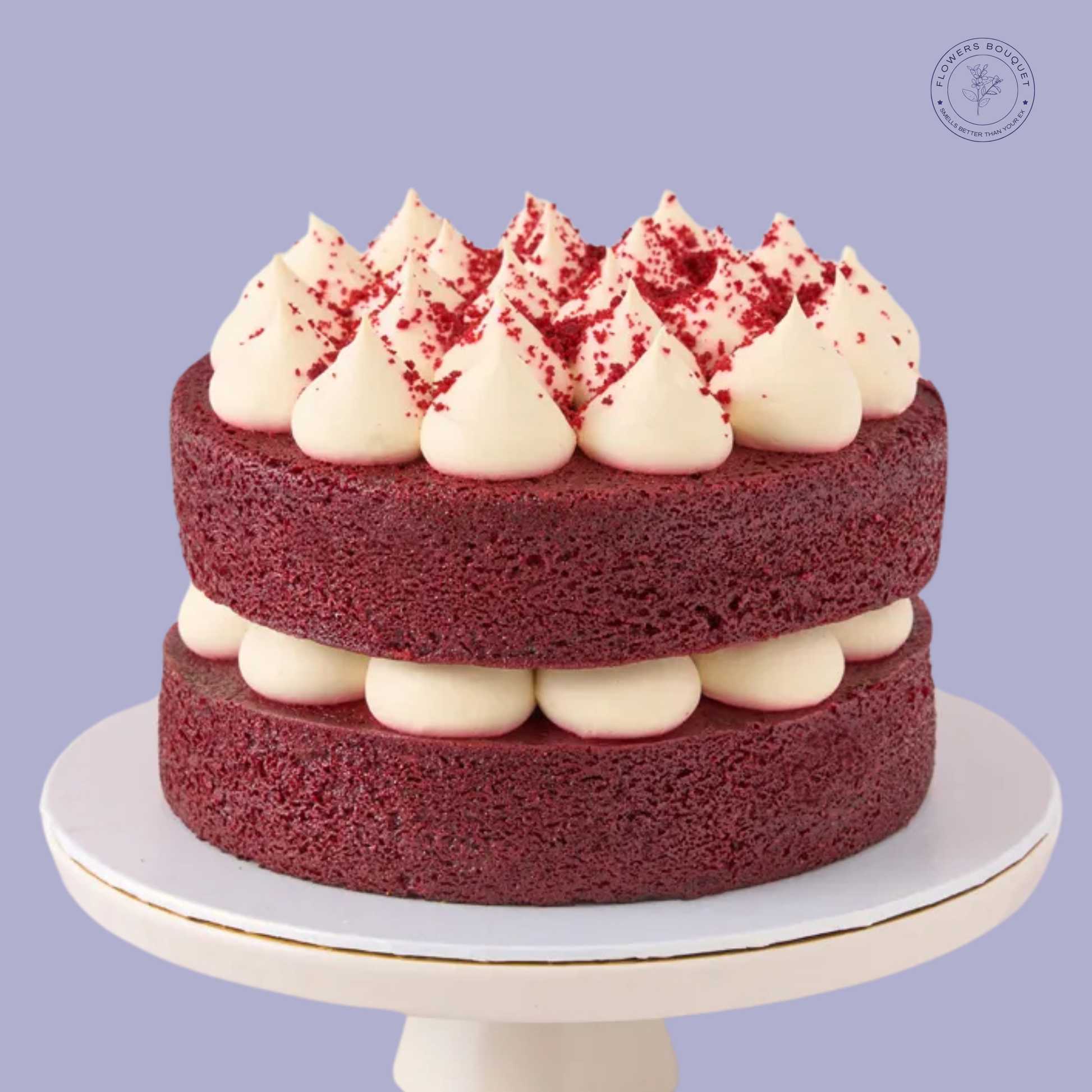 Classic Red Velvet Cake with cream cheese frosting and red velvet crumb topping, displayed on a white cake stand.