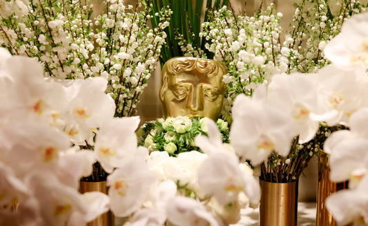White Orchid and Blossoms arrangement in a gold vase, perfect for luxury events and award ceremonies.