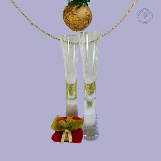 Golden Elegance Champagne Gift Set with crystal glasses, golden bauble, velvet gift pouch, and bead garland.