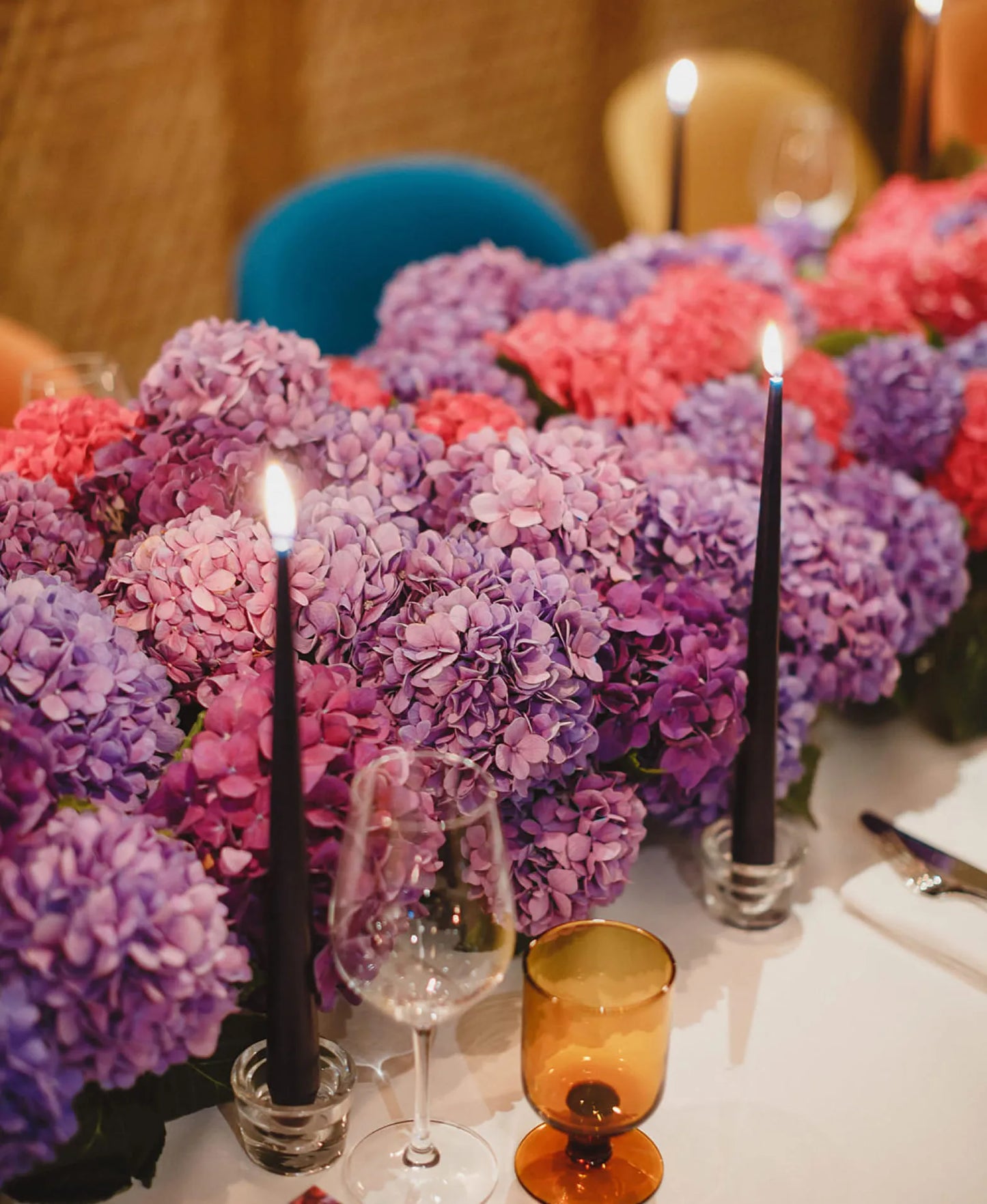 Elegant Floral Table Setting with Candles and Purple Orchids