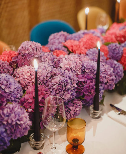 Elegant Floral Table Setting with Candles and Purple Orchids