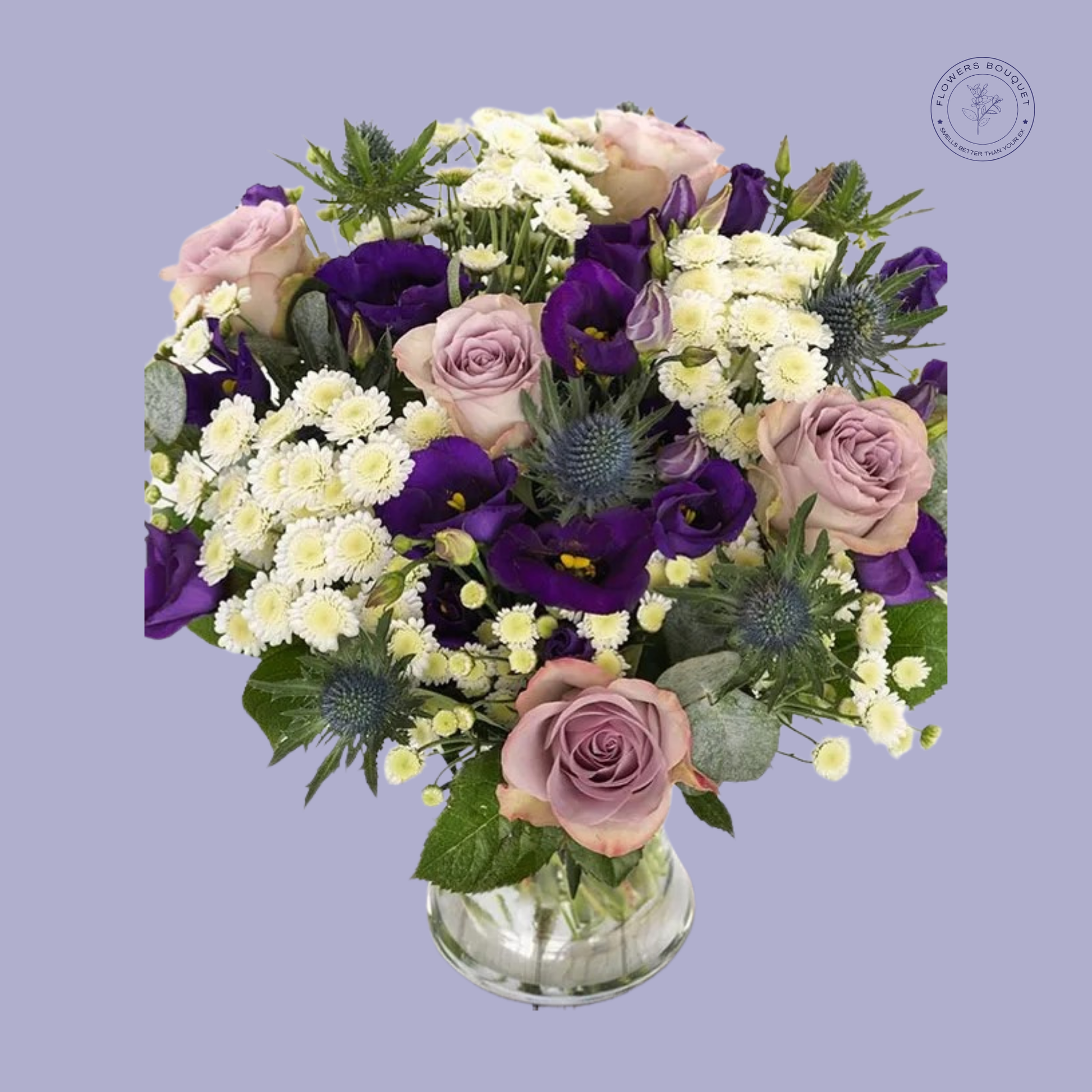 Lavender rose and purple blooms bouquet in a clear vase.