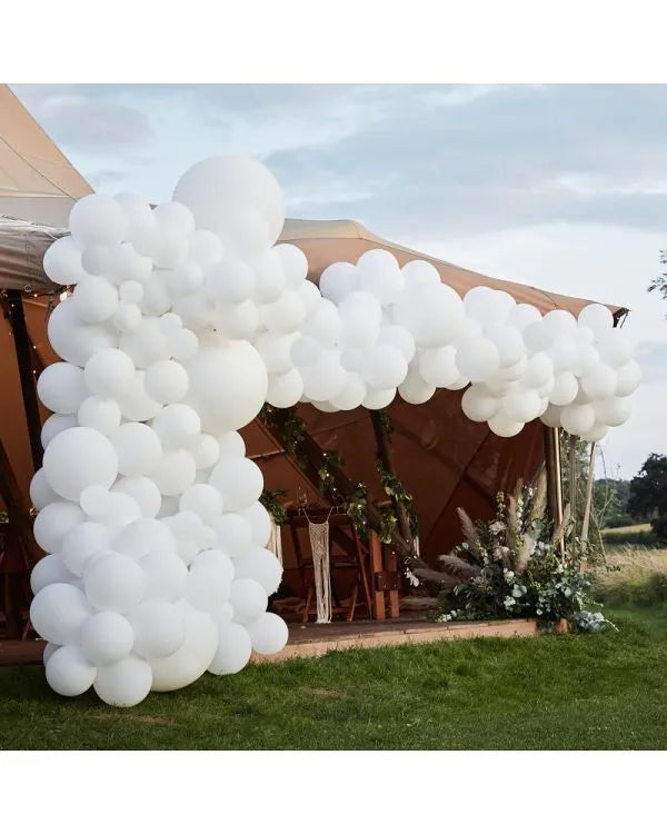 Luxury all-white balloon arch decoration for weddings, birthdays, and corporate events in the UK