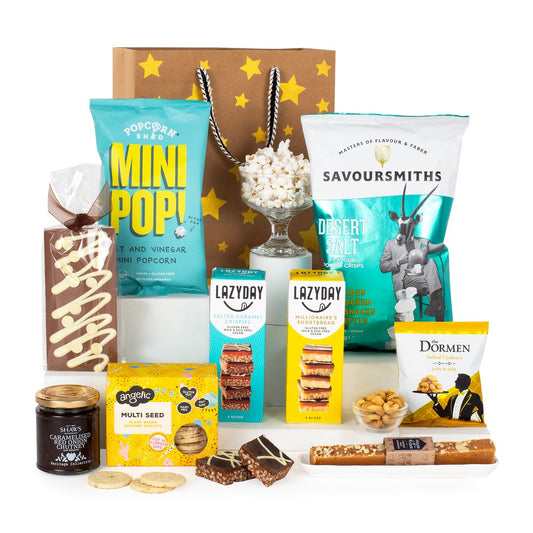 Luxury gluten-free gift hamper with crisps, popcorn, fudge, biscuits, chocolate, and chutney in a gold gift bag – ideal for UK delivery

