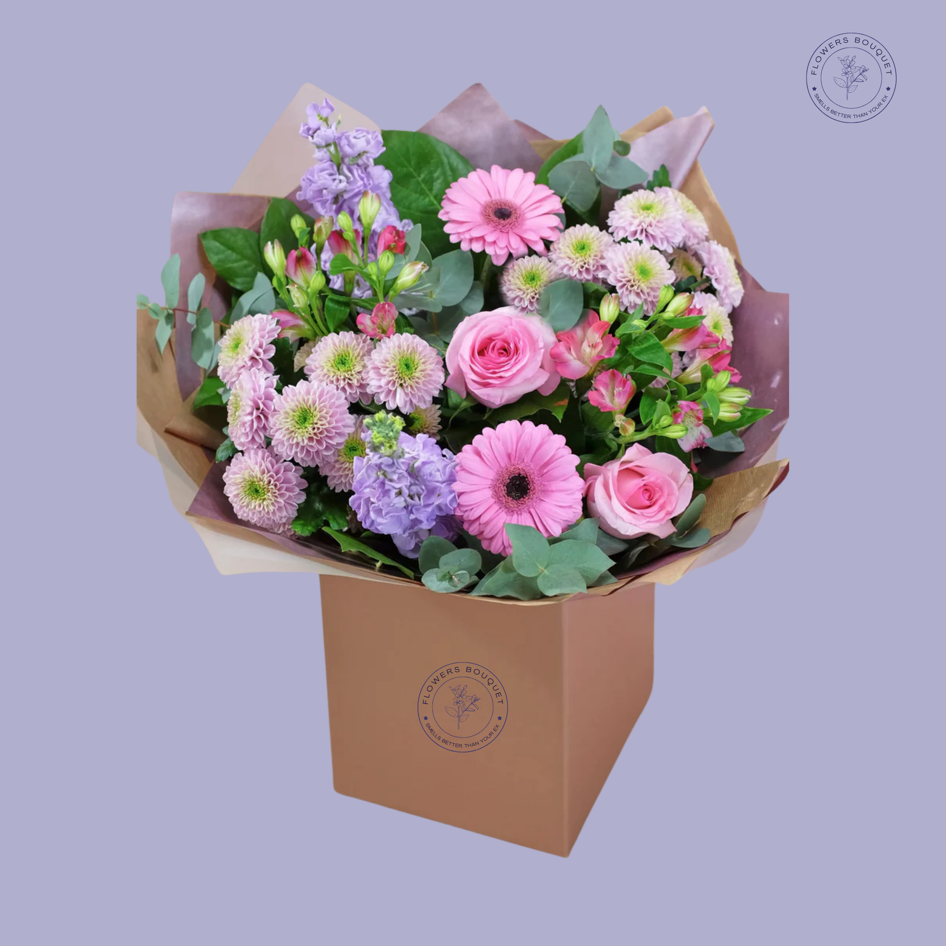 Pastel Garden Bouquet featuring pink roses, gerberas, purple stock flowers, and chrysanthemums, elegantly arranged in a gift box.