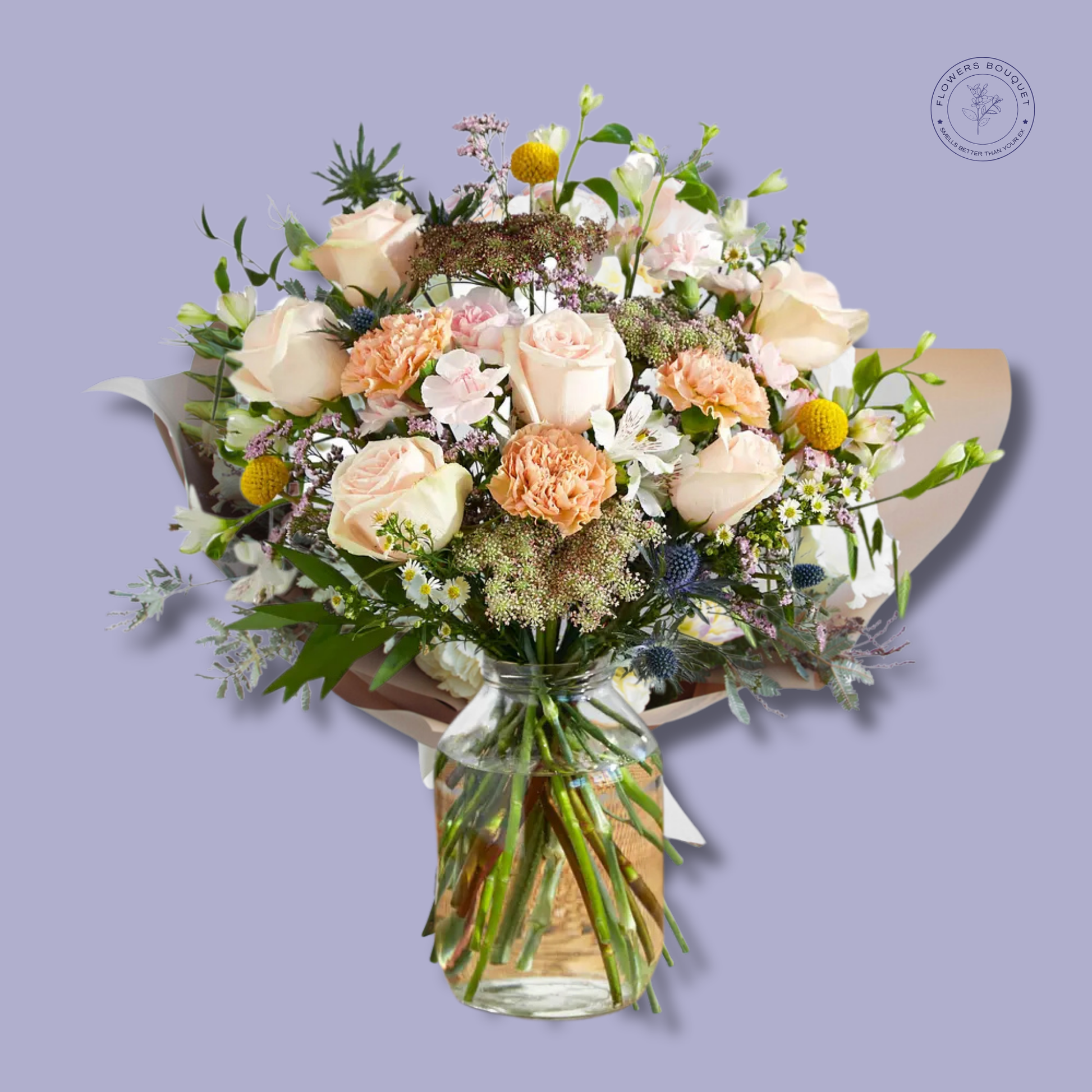 A soft and elegant floral arrangement called "Peach Bloom Harmony," featuring peach roses, carnations, alstroemeria, and wildflowers in a clear glass vase with visible stems and water.