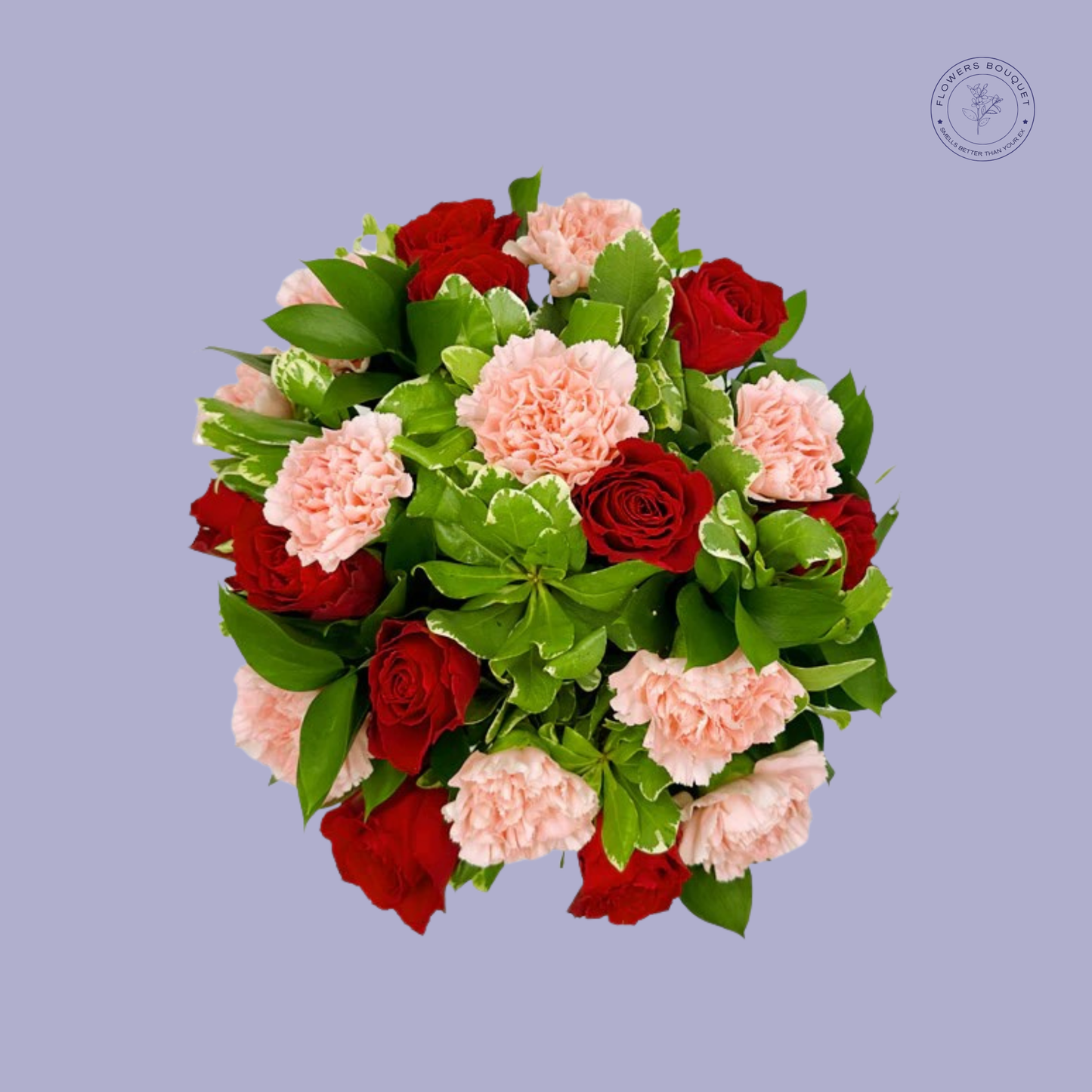 Red roses and pink carnations bouquet with lush greenery in a clear vase.