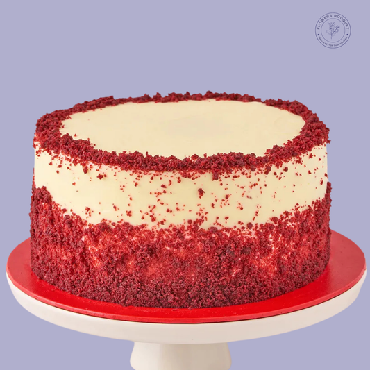 Red Velvet Birthday Cake with smooth cream cheese frosting and red velvet crumb border, perfect for celebrations.