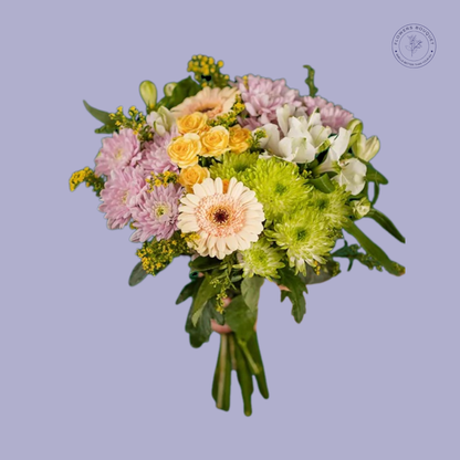 Sunshine Garden Bouquet featuring yellow roses, chrysanthemums, and gerberas in a clear vase.