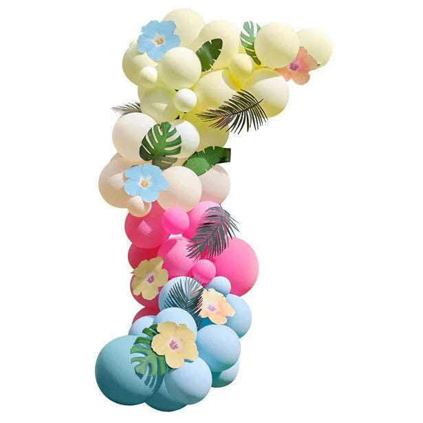 Tropical balloon garland arch with pastel balloons, floral accents, and tropical leaves for garden party decoration