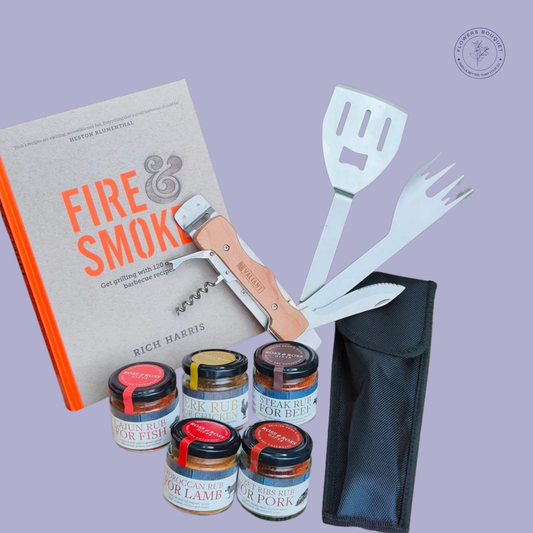 Ultimate BBQ gift set with Fire & Smoke cookbook, a multifunctional BBQ tool, and five jars of gourmet spice rubs.