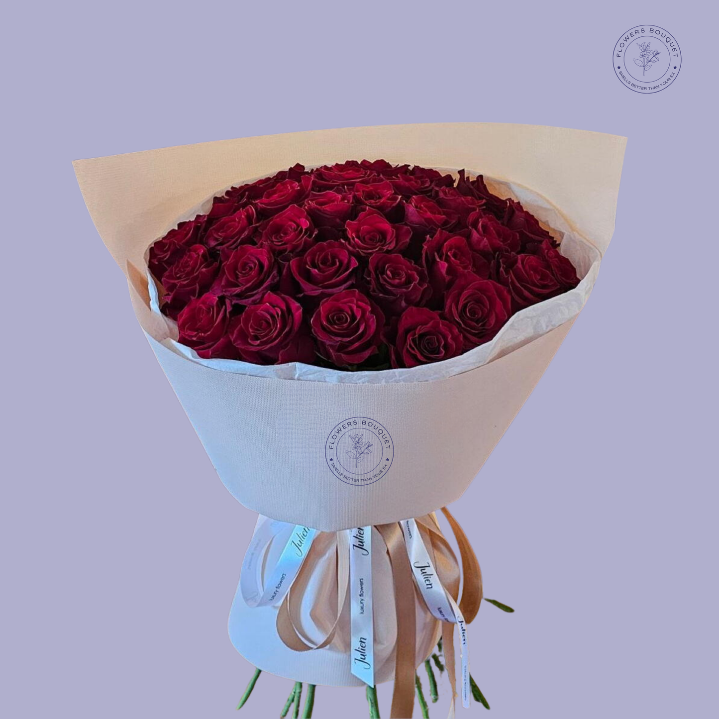 Velvet Passion bouquet featuring 50 premium red roses elegantly wrapped in white luxury paper with satin ribbons.