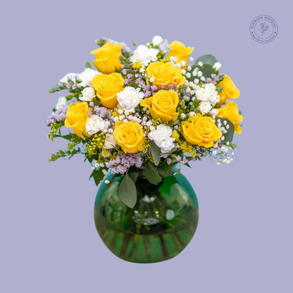 Yellow Roses & Baby's Breath Bouquet with vibrant yellow roses, white fillers, and purple accents in a glass vase.